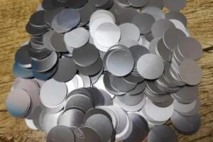 The freshly processed aluminum round pieces